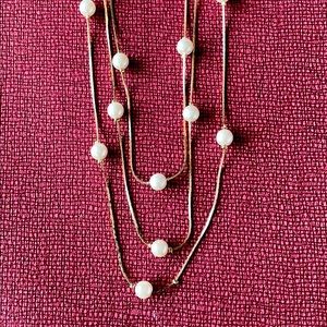 Gold pearl-like necklace